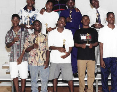 Circa 1996. Group picture of the volunteer coaches and players honorees at the Matching Neighborhood Matching Grant Sports Awards Event. Congratulation.
