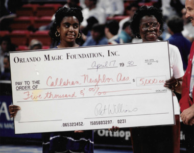 Circa 1990. Community partnership with the Callahan Neighborhood Association and the Home Team, Our Orlando Magic. $5000,00 donation from The Orlando Magic Foundation, Inc. Receiving donation check from Orlando Magic
